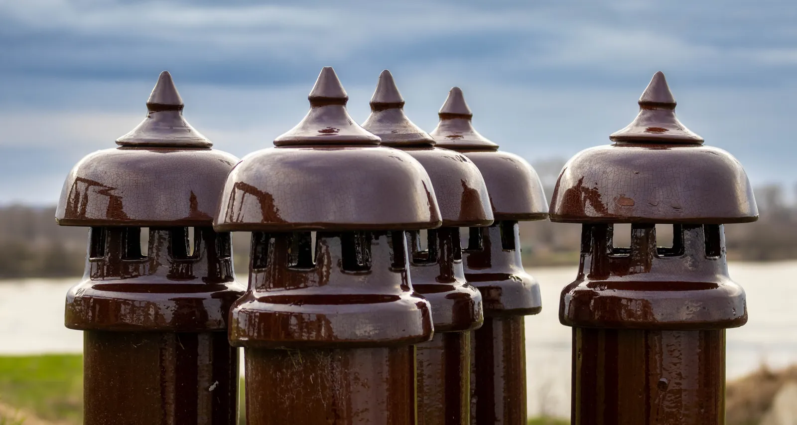 Cluster of ceramic ventilation caps on a roof