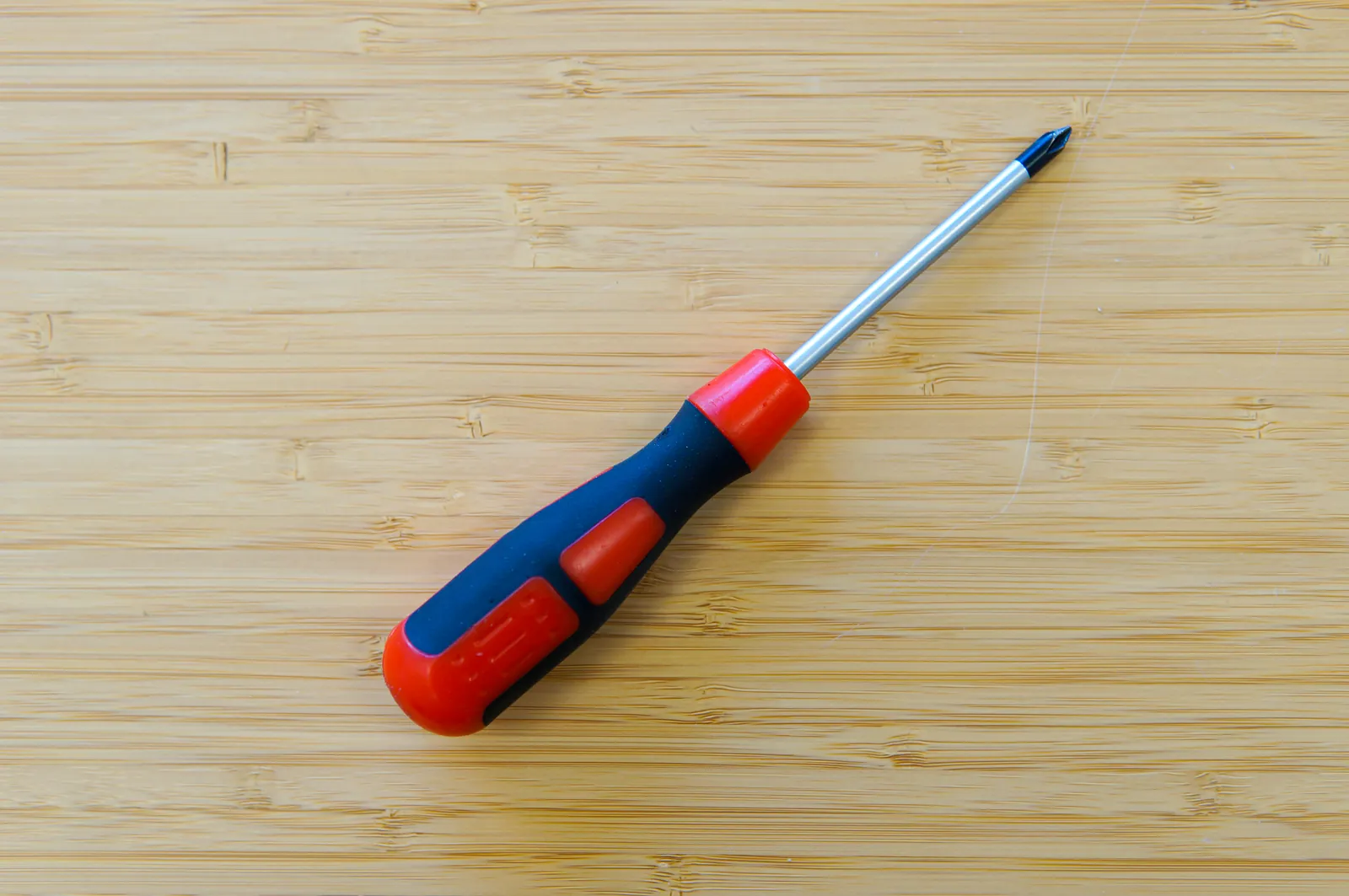 Phillips screwdriver lying on a wooden surface